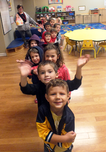 Preschoolers lined up, ready to walk to the fire station