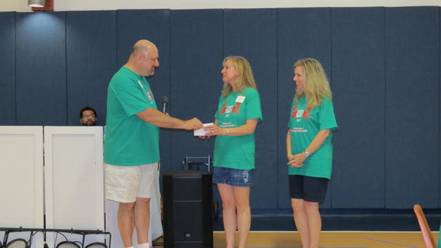 Lesley Andrews and Laura Burton receiving a donation on behalf of Pathways Cooks